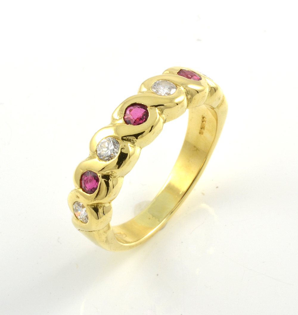 18ct gold brilliant cut ruby and diamond half eternity ring